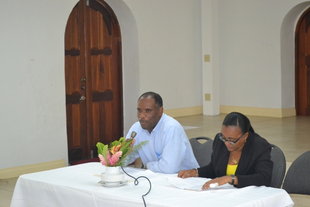 (L-r) Permanent Secretary in the Ministry of Finance Colin Dore and Director of Small Enterprise Development Unit Catherine Forbes at the opening ceremony of the Caribbean Development Bank funded Managing for Development Results workshop at the St. Paul’s Anglican Church Hall on April 12, 2016